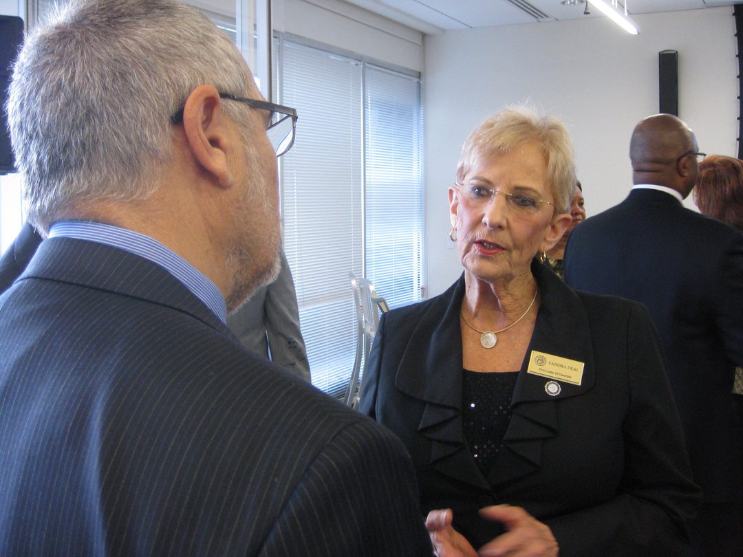 Georgia first lady Sandra Deal speaks with Center for Sustainable Journalism executive director at the opening of the CSJ's new offices in Kennesaw, Ga.